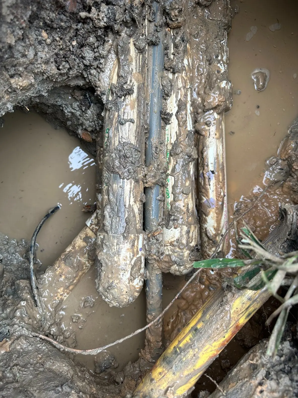 Underground swimming pool plumbing manifold replacement