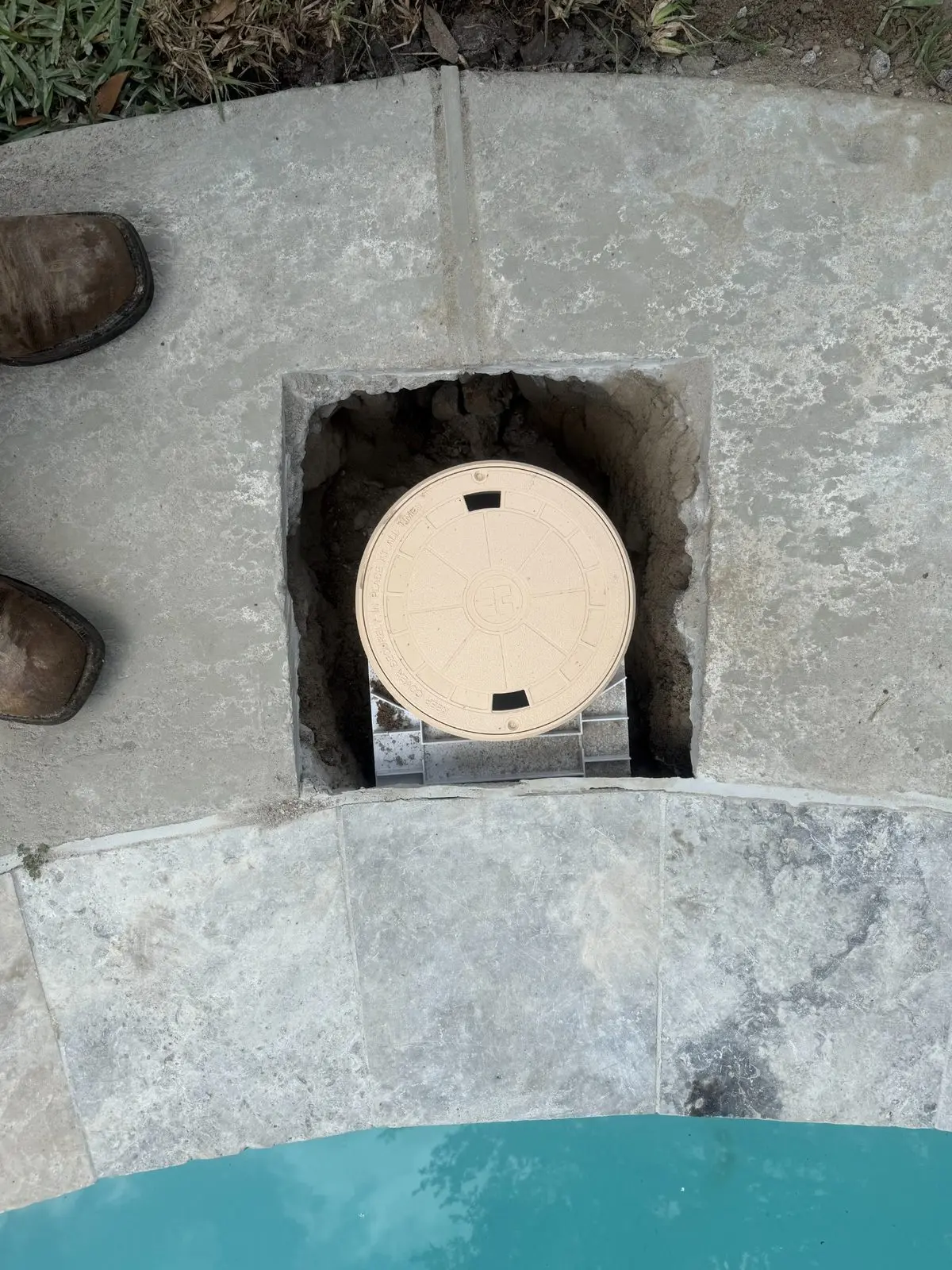 Swimming pool skimmer replacement installation in progress