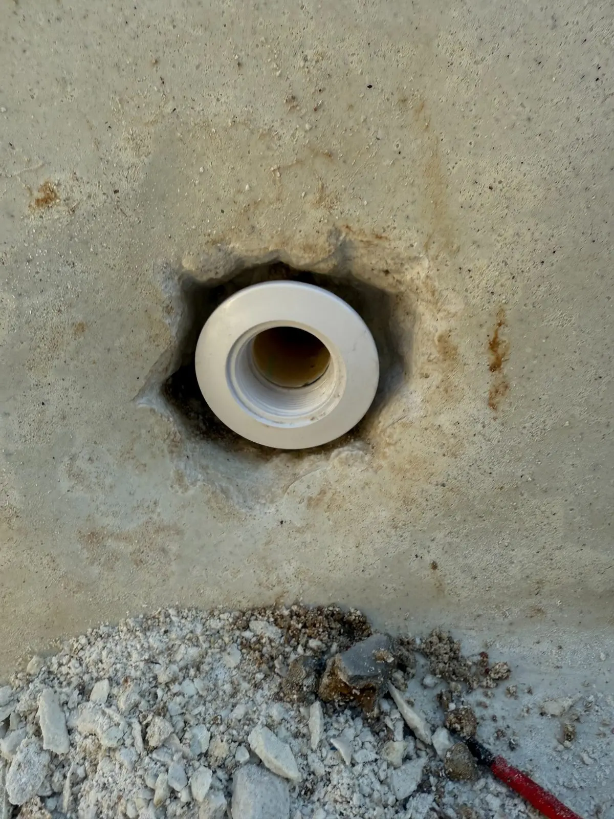 Swimming pool plumbing repair in an excavated area
