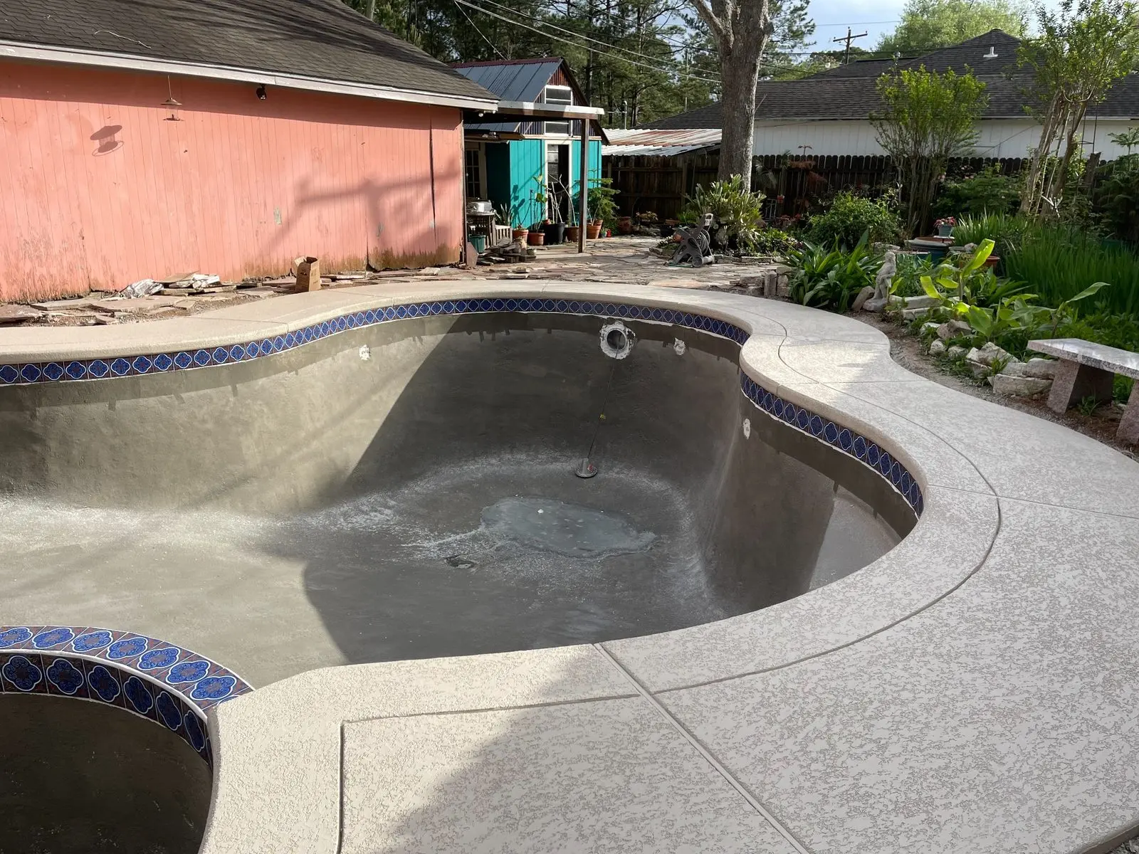 Drained swimming pool before surface restoration