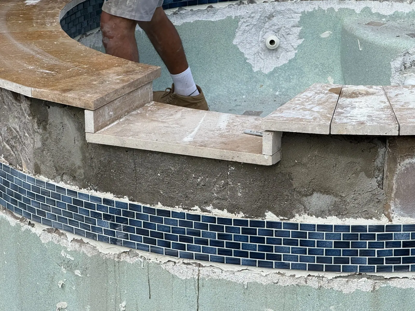Raised spa tile and coping repair